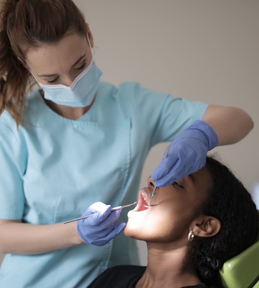 Dental professional assisting a patient in a modern clinic